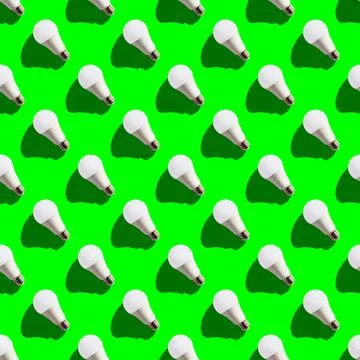 Seamless pattern. white lightbulbs is left up on green background. geometric  Stock Photos
