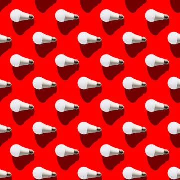 Seamless pattern. white lightbulbs is left on red background. geometric arran Stock Photos