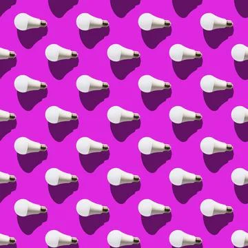Seamless pattern. white lightbulbs is left on violet background. geometric ar Stock Photos