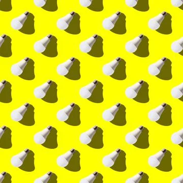 Seamless pattern. white lightbulbs is left down on yellow background. geometr Stock Photos
