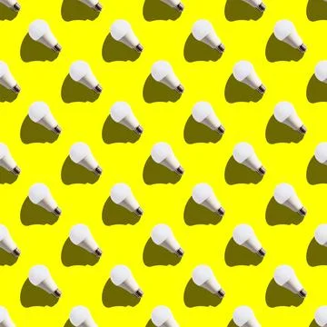 Seamless pattern. white lightbulbs is left up on yellow background. geometric Stock Photos