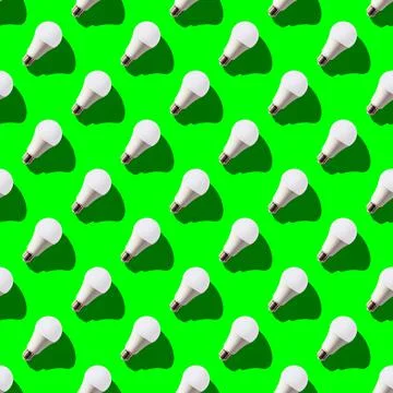Seamless pattern. white lightbulbs is right up on green background. geometric Stock Photos