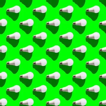 Seamless pattern. white lightbulbs is right on green background. geometric ar Stock Photos