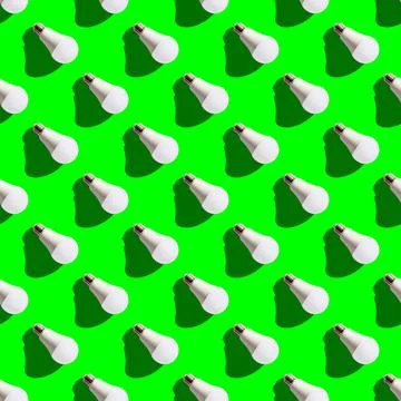 Seamless pattern. white lightbulbs is right down on green background. geometr Stock Photos