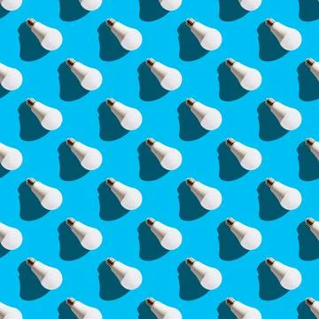 Seamless pattern. white lightbulbs is right down on light blue background. ge Stock Photos