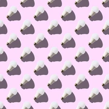 Seamless pattern. white lightbulbs is right up on pink background. geometric  Stock Photos