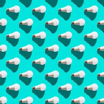 Seamless pattern. white lightbulbs is right on turquoise background. geometri Stock Photos