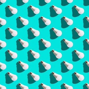 Seamless pattern. white lightbulbs is right down on turquoise background. geo Stock Photos