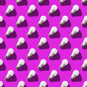 Seamless pattern. white lightbulbs is right up on violet background. geometri Stock Photos