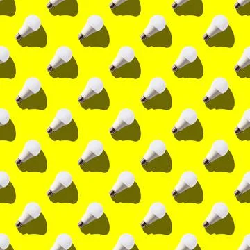 Seamless pattern. white lightbulbs is right up on yellow background. geometri Stock Photos