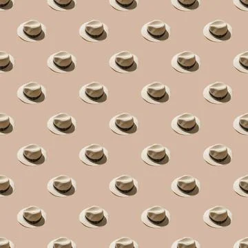 Seamless pattern with white straw wicker hats on a sand color background. har Photos