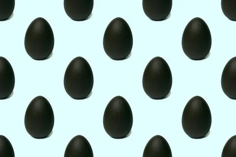 Seamless pattern of a whole chocolate Easter egg on a blue background, tinted Stock Photos