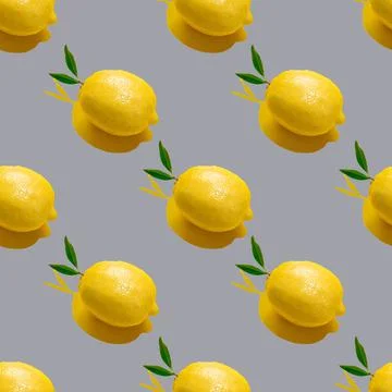 Seamless pattern with whole lemon and leaves on a gray background Stock Photos