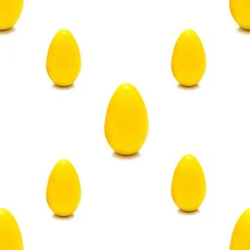 Seamless pattern of yellow Easter eggs on a white background. Isolate. Stock Photos