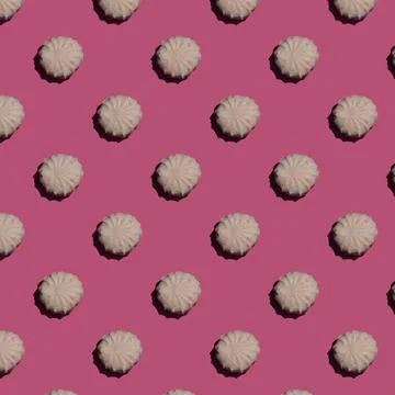 Seamless pattern with zephyr, marshmallows on a pink background as a creative Stock Photos