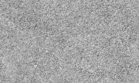 Seamless photo texture featuring gray granite surface. Black and white back.. Stock Photos