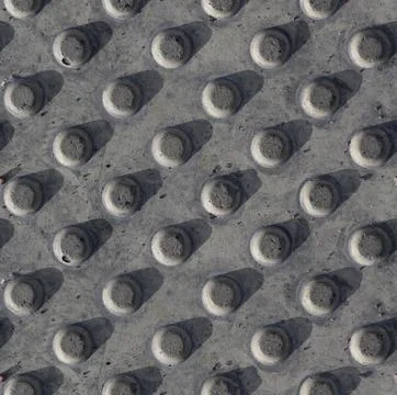 Seamless polka dot pattern. Square fragment of concrete stone gray wall Stock Photos