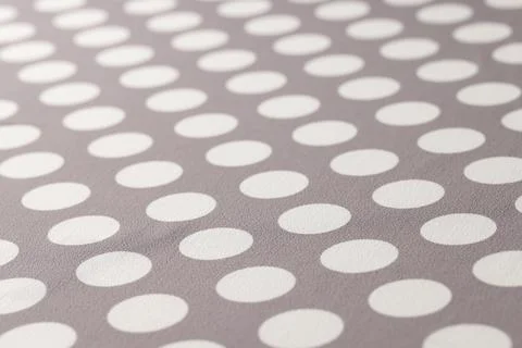 Seamless polka dots gray pattern closeup. Polka dot fabric Stock Photos