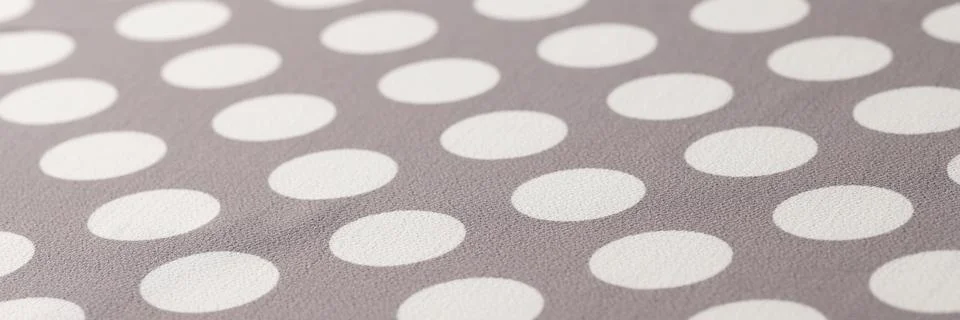 Seamless polka dots gray pattern closeup. Polka dot fabric Stock Photos