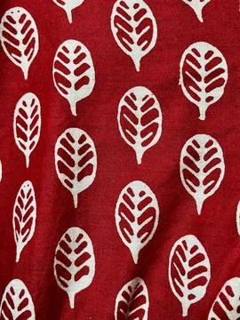 Seamless red fabric background texture featuring abstract white leaf block Stock Photos