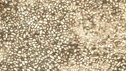 Seamless rotating loop of a natural pebble stone wash textured floor surfac.. Stock Footage 343512172