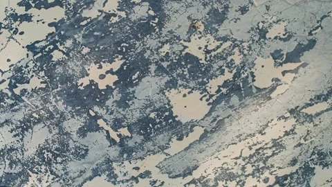 Seamless rotating loop of a weathered grungy wall texture featuring peeling.. Stock Footage 343513189