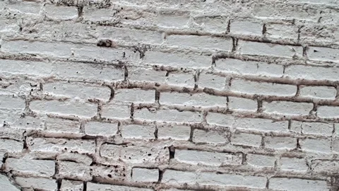 Seamless rotating loop of a weathered white brick wall texture featuring ro.. Stock Footage 343514472