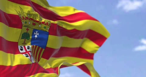 Seamless slow motion of the Aragonese flag waving in the wind on a clear day Stock-Footage 196935395