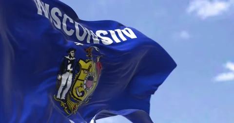 Seamless slow motion of the US state flag of Wisconsin waving in the wind. Video stock 187298703