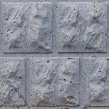 Seamless soft focus texture of decorative concrete wall from bricks. Stock Photos