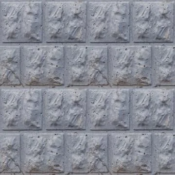 Seamless soft focus texture of decorative concrete wall from bricks. Stock Photos