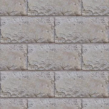 Seamless soft focus texture of decorative concrete wall from bricks. Stock Photos