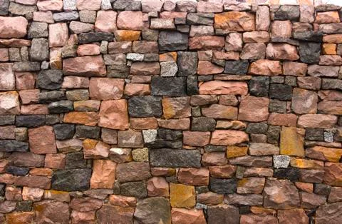 Seamless stone masonry using rectangular stones, red and gray shades Stock Photos