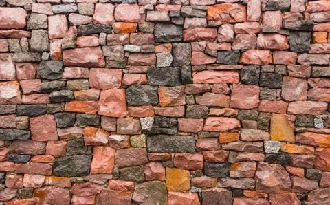 Seamless stone masonry using rectangular stones, red and gray shades Stock Photos