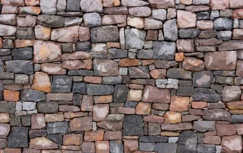 Seamless stone masonry using rectangular stones, red and gray shades Stock Photos