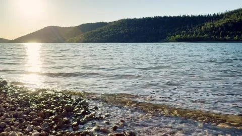 🌅 Seamless Sunset Waters: Slow Motion Golden Hour Reflection on Navajo Lake Stock Footage 340419683