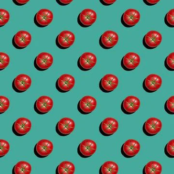 Seamless texture background pattern from fresh red tomatoes on a colored back 写真素材