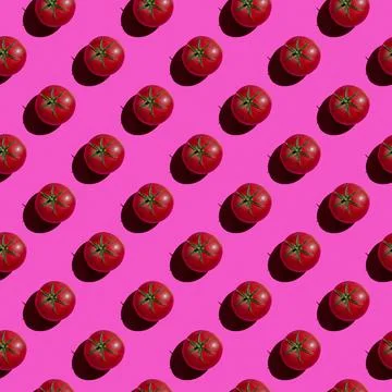 Seamless texture background pattern from fresh red tomatoes on a colored back 写真素材