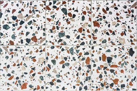 Seamless texture of ceramic tiles with a pattern in the Terrazzo style. Spo.. Stock Photos