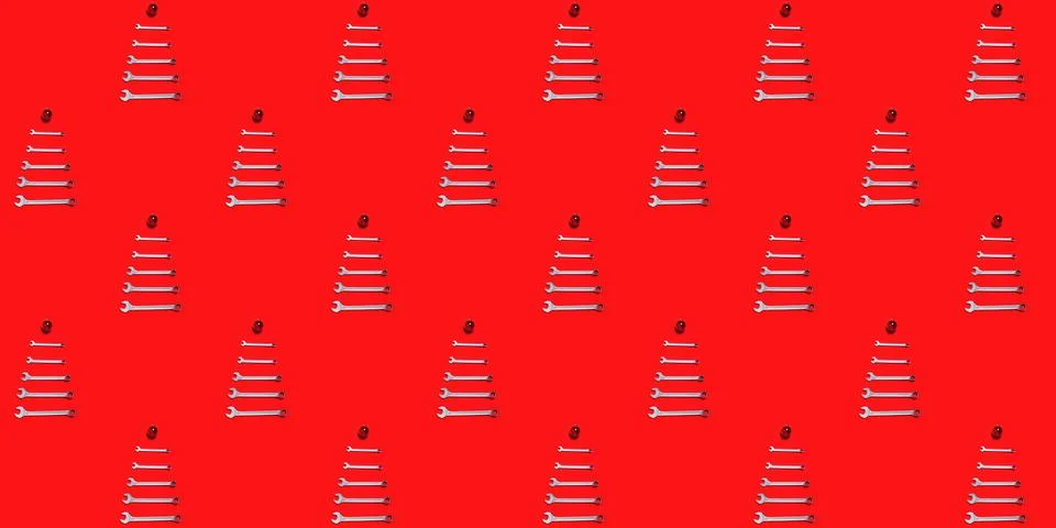 Seamless texture with Christmas trees made of wrenches decorated with balls on a 스톡 사진