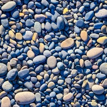 Seamless texture of a rocky surface with pebbles Stock Photos