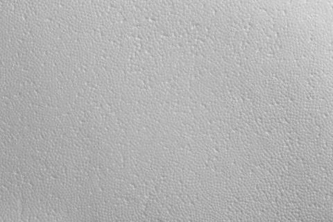 Seamless texture of white polystyrene foam or styrofoam, close-up flat white on Foto stock
