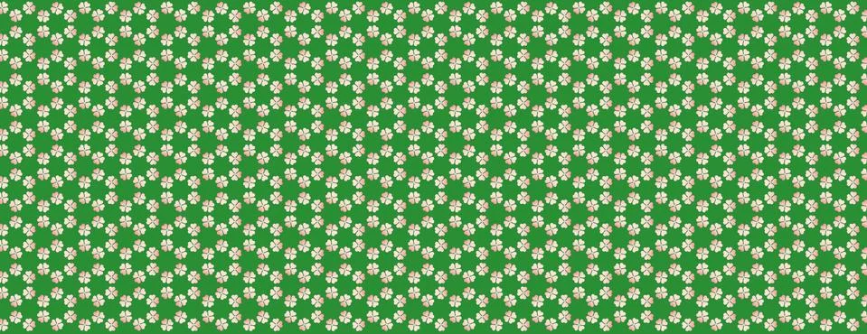 A seamless texture of white tiny four-leaf clovers arranged in the green back Foto stock