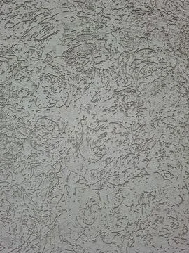 Seamless textured grey plaster background with decorative artistic wall fin.. Stock Photos