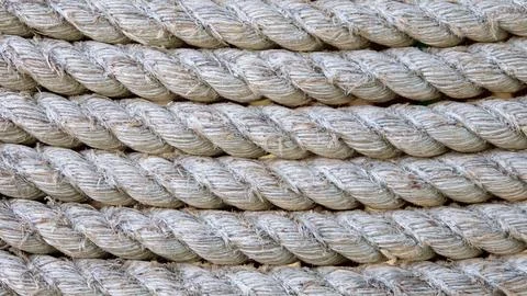 Seamless tied rope in a row in parallel line background in closeup 库存照片