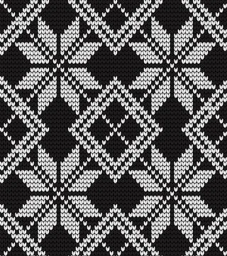 Seamless vector geometric pattern knitted black and white Stock Illustration