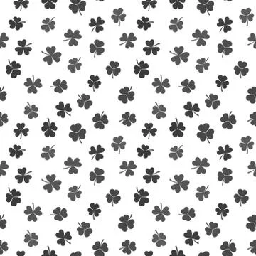 Seamless vector pattern made from dark shamrocks or clovers Stock Illustration