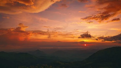 Seamless video loop / cinemagraph of a beautiful sunset above the jungle Stock Footage 120720428