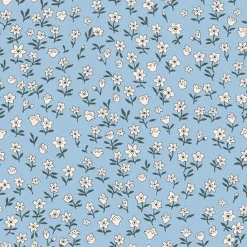 Seamless vintage pattern. Small white flowers. Light blue background. Vector  Stock Illustration