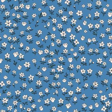 Seamless vintage pattern. Small white flowers. Blue background. Vector textur Stock Illustration